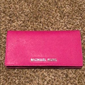 Michael Korls pink folding wallet